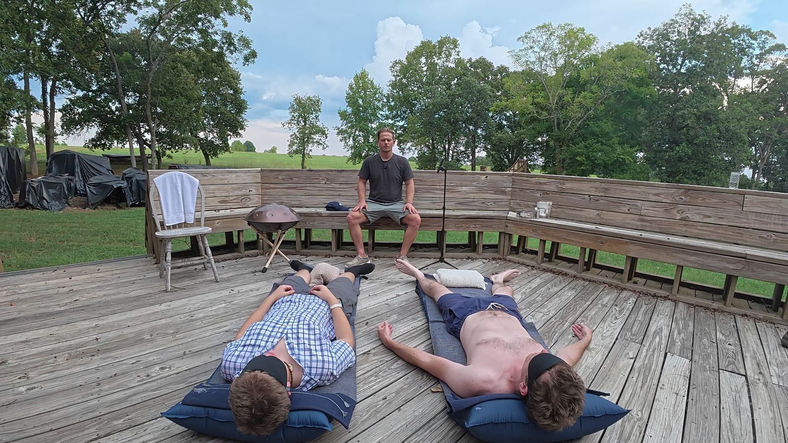 Two men lying on mats during a Dynamic breathwork round